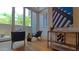 Stylish living room featuring modern furniture, bar, artwork, and access to a private patio at 5455 E Lincoln Dr # 1004, Paradise Valley, AZ 85253