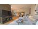 Open concept living space showcasing modern furnishings, a staircase, and a view of the dining area and kitchen at 5455 E Lincoln Dr # 1004, Paradise Valley, AZ 85253