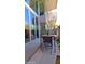 Outdoor dining area with table and chairs, accessed by large glass doors, with a modern design at 5455 E Lincoln Dr # 1004, Paradise Valley, AZ 85253