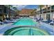 A pristine pool offers lounge chairs and mountain views on a sunny day, perfect for relaxation at 5455 E Lincoln Dr # 1004, Paradise Valley, AZ 85253