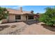 Expansive backyard featuring a covered patio, mature trees, and low-maintenance desert landscaping at 5860 W Saragosa St, Chandler, AZ 85226