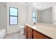Well-lit bathroom featuring tile floors, a wide mirror, and a shower-tub combination at 5860 W Saragosa St, Chandler, AZ 85226