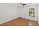 Inviting bedroom with warm laminate floors and natural light from the window at 5860 W Saragosa St, Chandler, AZ 85226