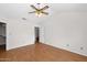 Spacious bedroom with vaulted ceiling, wood floors, and neutral walls at 5860 W Saragosa St, Chandler, AZ 85226