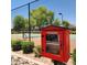 Outdoor community book exchange at the neighborhood tennis court offers reading and recreation at 5860 W Saragosa St, Chandler, AZ 85226