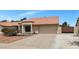 Inviting single-story home with a terracotta roof, two-car garage, desert landscaping, and gated driveway at 5860 W Saragosa St, Chandler, AZ 85226