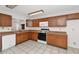 Functional kitchen with white appliances, ample cabinets, and tile flooring at 5860 W Saragosa St, Chandler, AZ 85226