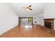 Bright living room features wood floors, a fireplace, and large windows for natural light at 5860 W Saragosa St, Chandler, AZ 85226