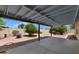 Outdoor patio space featuring a concrete floor, wood awning, and a desert-style yard at 5860 W Saragosa St, Chandler, AZ 85226