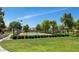 Community tennis court surrounded by lush landscaping, ideal for recreational activities at 5860 W Saragosa St, Chandler, AZ 85226