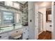 Bathroom featuring a makeup vanity with bright overhead lighting and rustic wood-look paneling at 632 S 83Rd Way, Mesa, AZ 85208