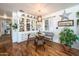 Cozy dining room with a glass table, built-in display cabinet, and hardwood floors at 632 S 83Rd Way, Mesa, AZ 85208