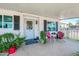 Charming front porch with cozy seating area and landscaped surroundings at 632 S 83Rd Way, Mesa, AZ 85208