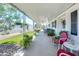 Expansive covered front porch offering comfortable seating and garden views at 632 S 83Rd Way, Mesa, AZ 85208