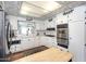 Well-maintained kitchen with white cabinets, stainless steel appliances, and modern countertops at 632 S 83Rd Way, Mesa, AZ 85208