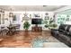 Inviting living room featuring hardwood floors, white walls, and lots of natural lighting at 632 S 83Rd Way, Mesa, AZ 85208