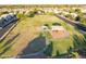 Aerial shot of a neighborhood park with playground and open green space, offering community recreation at 7463 E Monte Ave, Mesa, AZ 85209