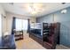 Bedroom with custom bunk bed, carpet flooring, desk space and ample lighting at 7463 E Monte Ave, Mesa, AZ 85209