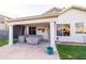 Inviting covered patio with seating area and sturdy columns, perfect for outdoor relaxation at 7463 E Monte Ave, Mesa, AZ 85209