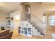 Spacious entryway with staircase, tile floors, and convenient built-in storage shelves at 7463 E Monte Ave, Mesa, AZ 85209