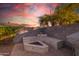 Outdoor fire pit area with built-in seating, ideal for evening gatherings and relaxation at 7463 E Monte Ave, Mesa, AZ 85209