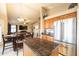This kitchen features a dining area, granite countertops, stainless steel appliances, and an island at 7463 E Monte Ave, Mesa, AZ 85209