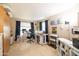 Home office with tile flooring, bright sunlight, printer and shelving space at 7463 E Monte Ave, Mesa, AZ 85209