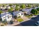 Street view of a well-manicured suburban home with a green lawn and mature trees at 7463 E Monte Ave, Mesa, AZ 85209