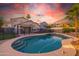 Home swimming pool with attached spa, privacy fence, and beautiful desert landscaping at 7463 E Monte Ave, Mesa, AZ 85209