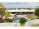 Aerial view of a luxurious home featuring a pool, lush landscaping, and a private backyard at 8601 E De La O Rd, Scottsdale, AZ 85255