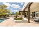 Inviting backyard featuring a pool, spa, outdoor fireplace, and seating areas at 8601 E De La O Rd, Scottsdale, AZ 85255