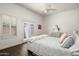 Bedroom featuring a ceiling fan and access to a patio at 8601 E De La O Rd, Scottsdale, AZ 85255