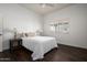 Bright bedroom with hardwood floors and a window overlooking a cactus at 8601 E De La O Rd, Scottsdale, AZ 85255