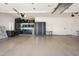 Spacious three car garage with epoxy flooring and built in shelving, and work bench at 8601 E De La O Rd, Scottsdale, AZ 85255