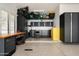 Organized garage with ample storage cabinets and workbench area at 8601 E De La O Rd, Scottsdale, AZ 85255