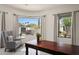 Bright living room featuring tile floors, neutral walls, and large windows with neighborhood views at 8601 E De La O Rd, Scottsdale, AZ 85255