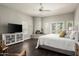 Spacious main bedroom with a fireplace, ceiling fan, and access to the outdoors at 8601 E De La O Rd, Scottsdale, AZ 85255
