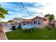 This beautiful backyard features a pool, ping pong table and outdoor lounge area at 8875 S Ash Ave, Tempe, AZ 85284