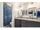 Bathroom with double sinks, granite countertops and tub-shower combo at 8875 S Ash Ave, Tempe, AZ 85284