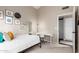 This bedroom includes a white desk, neutral walls and fun wall art at 8875 S Ash Ave, Tempe, AZ 85284