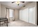 The bedroom boasts neutral walls, carpet floors, and closet with double doors at 8875 S Ash Ave, Tempe, AZ 85284
