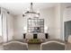 A dining room with a contemporary chandelier and modern table decor at 8875 S Ash Ave, Tempe, AZ 85284