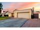 Home showcasing a spacious two-car garage, driveway, and landscaping at 8875 S Ash Ave, Tempe, AZ 85284