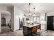 This modern kitchen features white cabinets, stainless steel appliances, and a large kitchen island at 8875 S Ash Ave, Tempe, AZ 85284