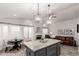 Modern kitchen open to the living room has stainless appliances and a large kitchen island at 8875 S Ash Ave, Tempe, AZ 85284