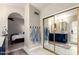 This ensuite bathroom features double sinks, shaker cabinets and large mirrors at 8875 S Ash Ave, Tempe, AZ 85284