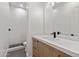 Modern bathroom with marble countertop vanity, and a tiled walk-in shower at 9820 N 87Th Pl, Scottsdale, AZ 85258
