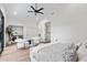 Bright, spacious bedroom features a ceiling fan, walk-in closet and convenient in-suite laundry at 9820 N 87Th Pl, Scottsdale, AZ 85258