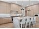 Spacious kitchen with marble island, bar seating, and stainless steel appliances at 9820 N 87Th Pl, Scottsdale, AZ 85258