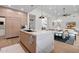 Contemporary kitchen with marble island, modern lighting, and an open floor plan at 9820 N 87Th Pl, Scottsdale, AZ 85258